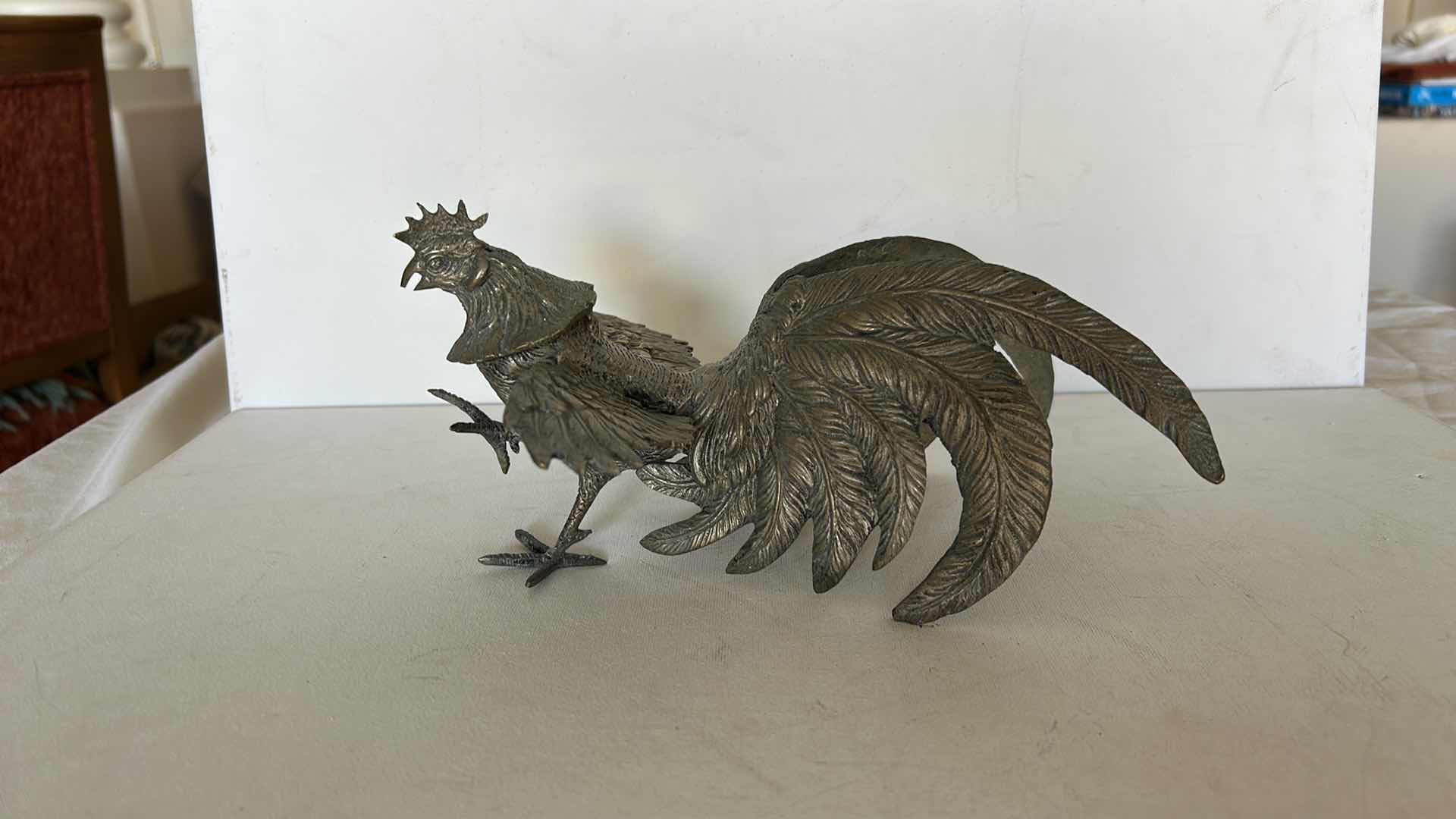Photo 1 of DECORATIVE METAL ROOSTER FIGURINE WITH DETAILED FEATHER DESIGN. 9” x H4 1/2”