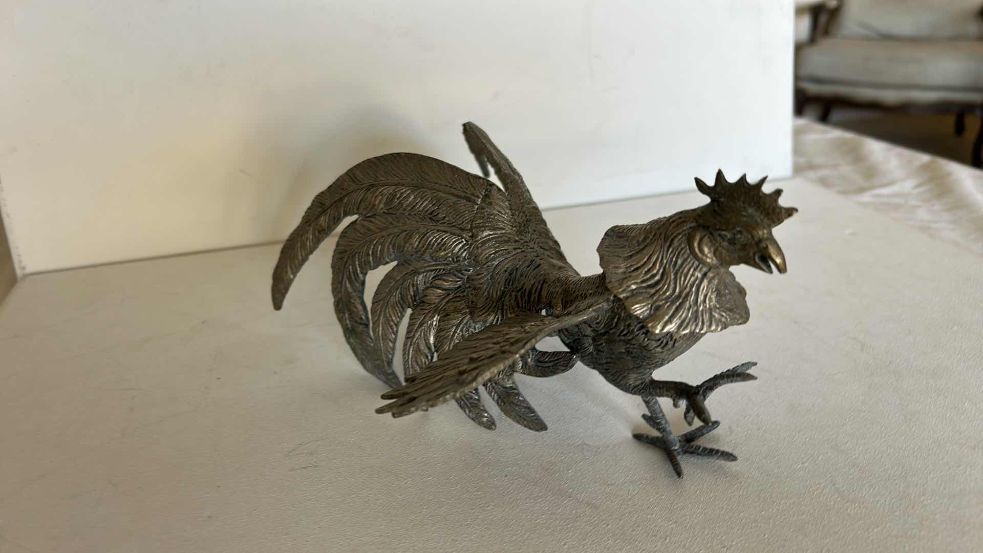 Photo 1 of DECORATIVE METAL ROOSTER FIGURINE WITH DETAILED FEATHER DESIGN. 9” x H4 1/2”