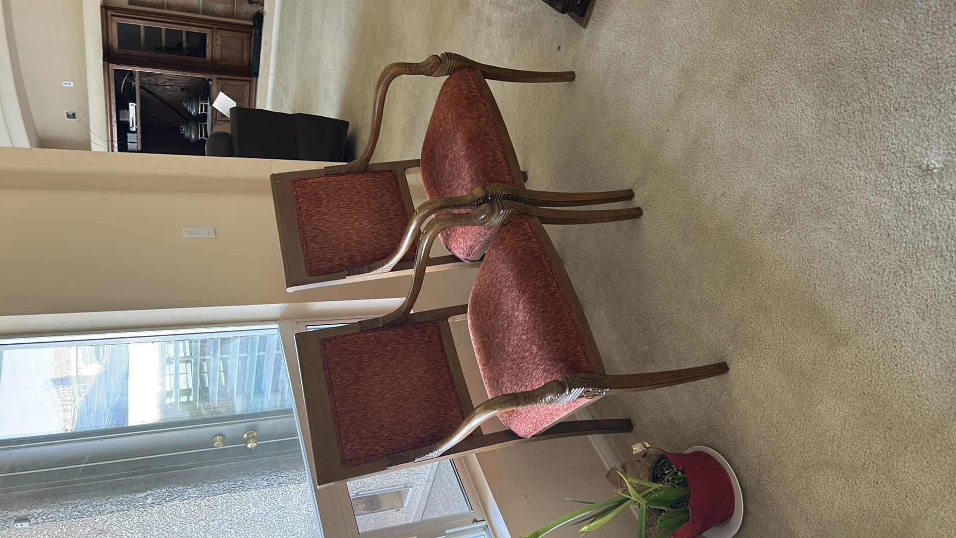 Photo 1 of SET OF TWO WOODEN ARMCHAIRS WITH UPHOLSTERED SEATS AND BACKS. FEATURES CURVED WOOD ARMS AND LEGS WITH RED FABRIC CUSHIONS. CLASSIC SIDE OR DINING CHAIRS.