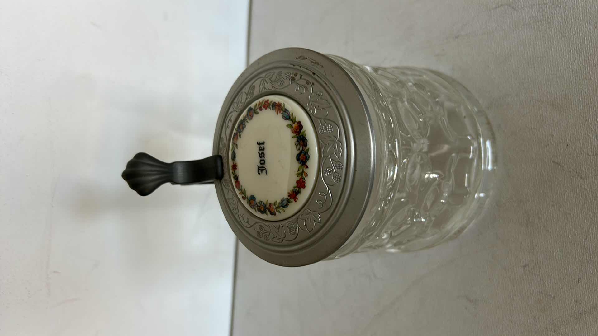 Photo 1 of ORIGINAL BMF SCHNAPSKRUGERL GLASS BEER STEIN.  WITH TEXTURED GLASS BODY AND PEWTER LID. FEATURES A THUMB LIFT HANDLE AND DECORATIVE TOP MEDALLION. H6”