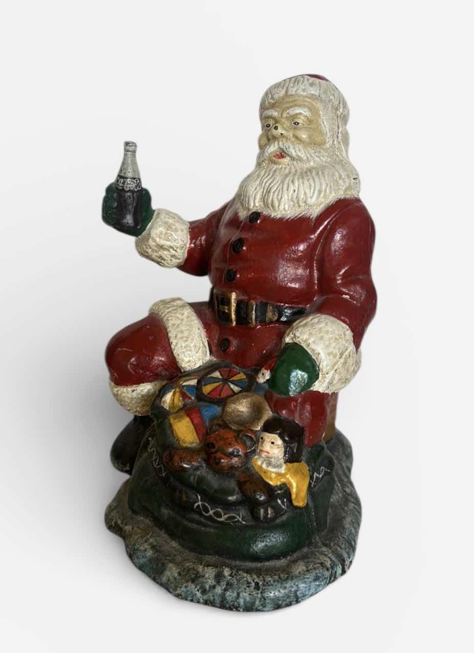 Photo 1 of CAST IRON VINTAGE SANTA CLAUSE HOLDING COCA COLA H8”