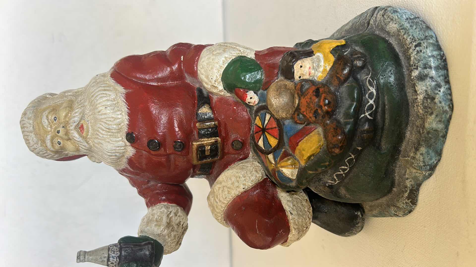 Photo 1 of CAST IRON VINTAGE SANTA CLAUSE HOLDING COCA COLA H8”