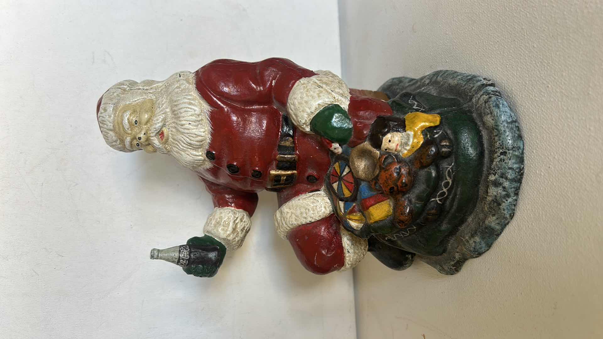 Photo 1 of CAST IRON VINTAGE SANTA CLAUSE HOLDING COCA COLA H8”