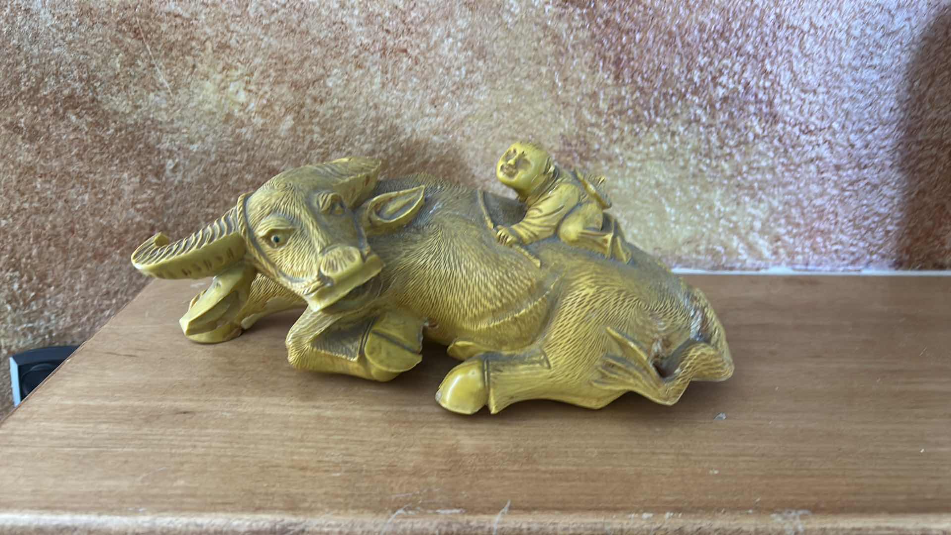 Photo 1 of RESIN SHEPHERD BOY RIDING A WATER BUFFALO, COMMONLY MARKETED AS A CHINESE FENG SHUI WEALTH SYMBOL. 9” x H4”