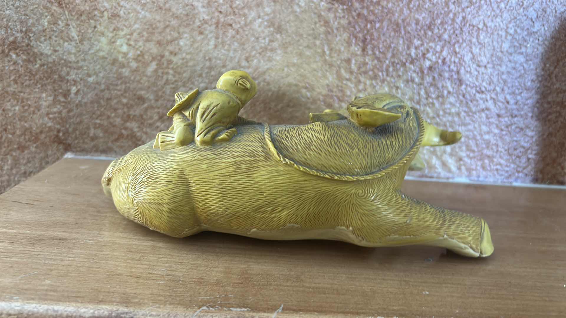 Photo 1 of RESIN SHEPHERD BOY RIDING A WATER BUFFALO, COMMONLY MARKETED AS A CHINESE FENG SHUI WEALTH SYMBOL. 9” x H4”