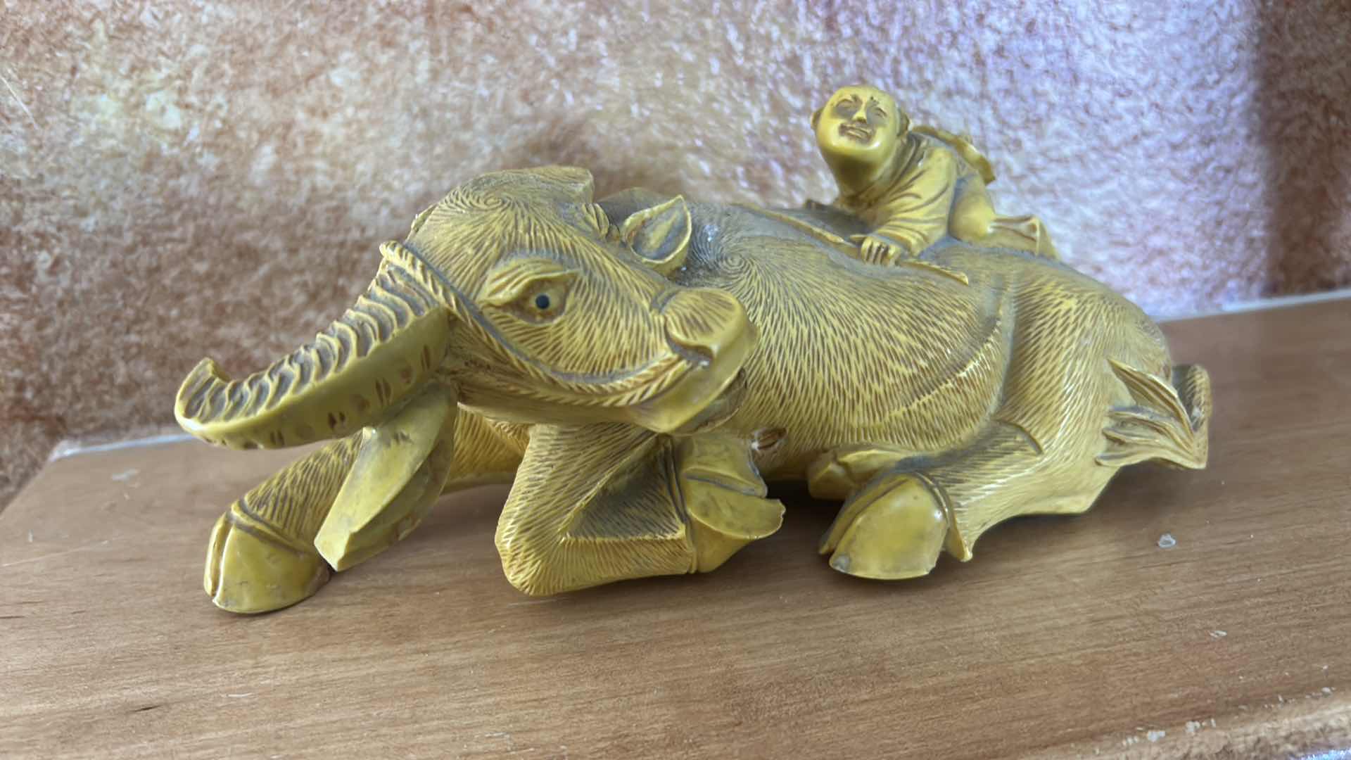 Photo 1 of RESIN SHEPHERD BOY RIDING A WATER BUFFALO, COMMONLY MARKETED AS A CHINESE FENG SHUI WEALTH SYMBOL. 9” x H4”