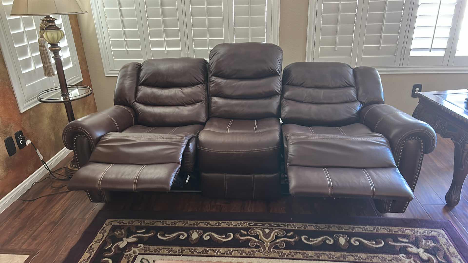 Photo 1 of 7 1/2’ POWER RECLINING LEATHER LOOK SOFA FEATURING CONTRASTING STITCHING, POWER RECLINE FUNCTIONALITY ON THE END SEATS,