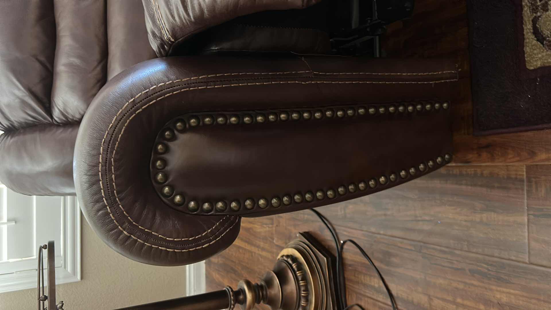 Photo 1 of 7 1/2’ POWER RECLINING LEATHER LOOK SOFA FEATURING CONTRASTING STITCHING, POWER RECLINE FUNCTIONALITY ON THE END SEATS,