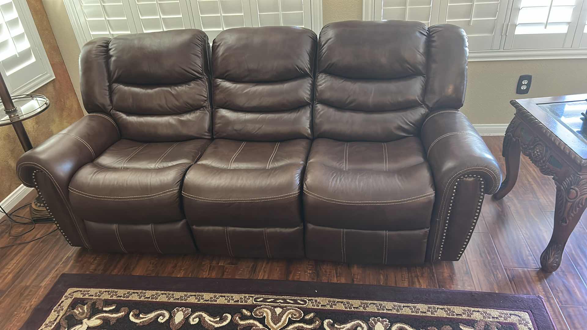 Photo 1 of 7 1/2’ POWER RECLINING LEATHER LOOK SOFA FEATURING CONTRASTING STITCHING, POWER RECLINE FUNCTIONALITY ON THE END SEATS,