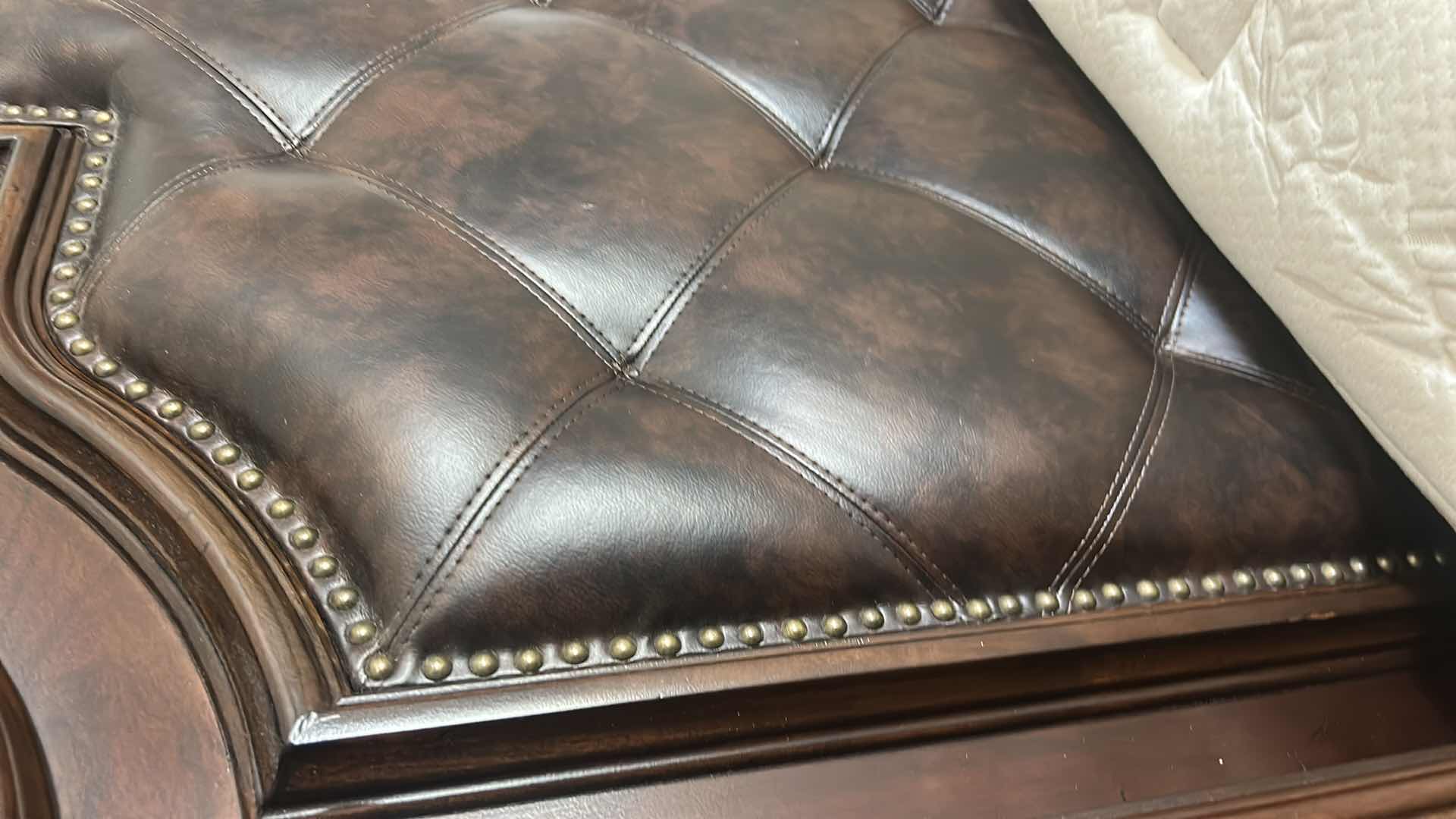 Photo 1 of HOMELEGANCE ADELINA COLLECTION PANEL BED, FEATURING A CHERRY FINISH, FAUX LEATHER UPHOLSTERED HEADBOARD WITH BUTTON TUFTING, AND INTRICATE WOOD CARVINGS. 7‘ x 8‘ x H6‘ $2200
