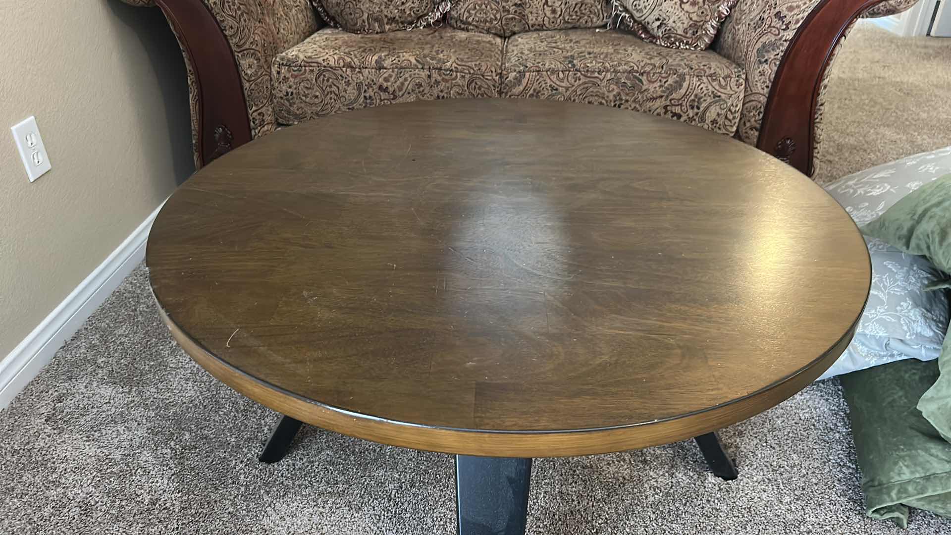Photo 1 of ROUND WOOD COCKTAIL TABLE WITH BLACK LEGS 3’ X H20”