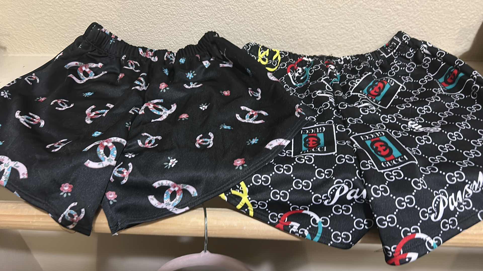 Photo 1 of CHANEL AND GUCCI SHORTS AND TOPS