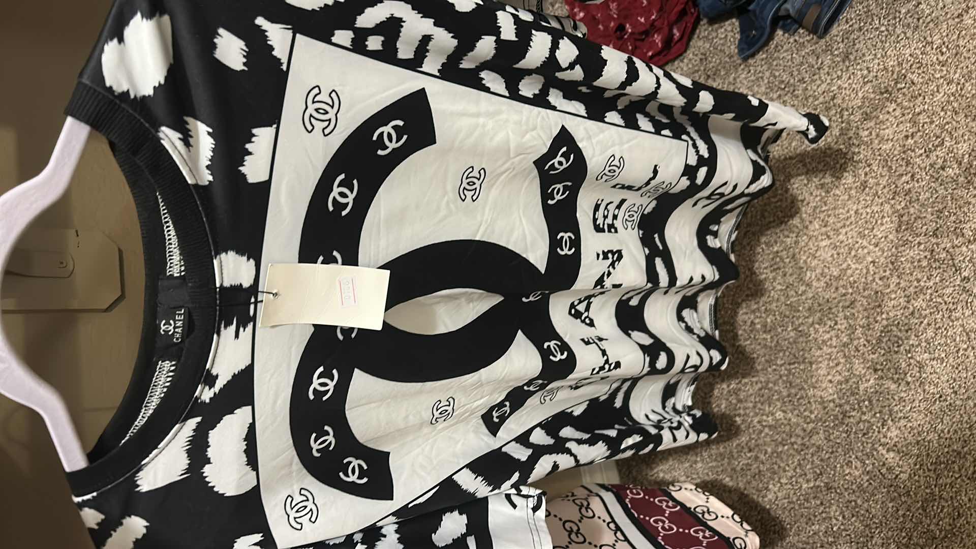 Photo 1 of CHANEL AND GUCCI SHORTS AND TOPS