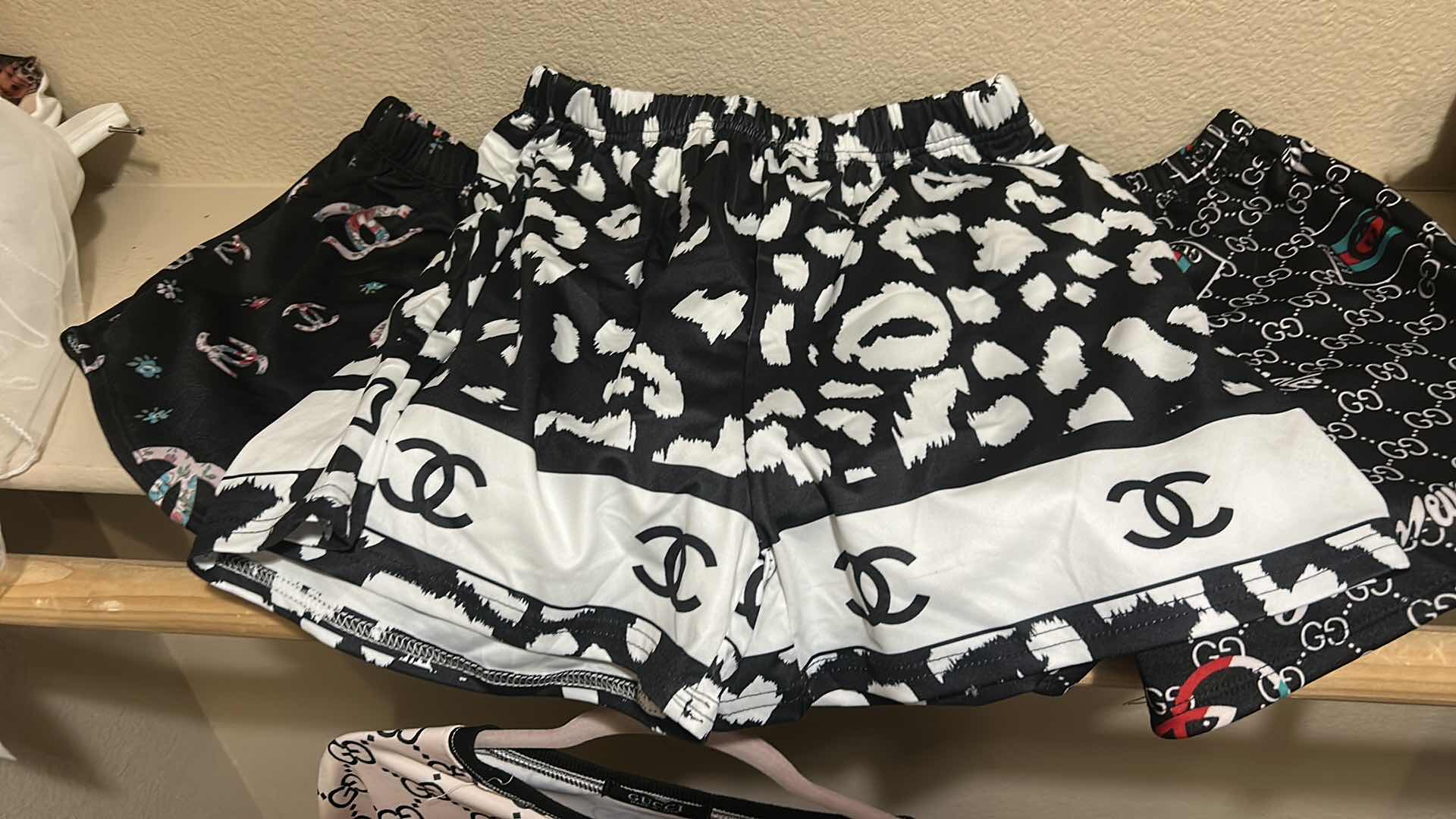 Photo 1 of CHANEL AND GUCCI SHORTS AND TOPS