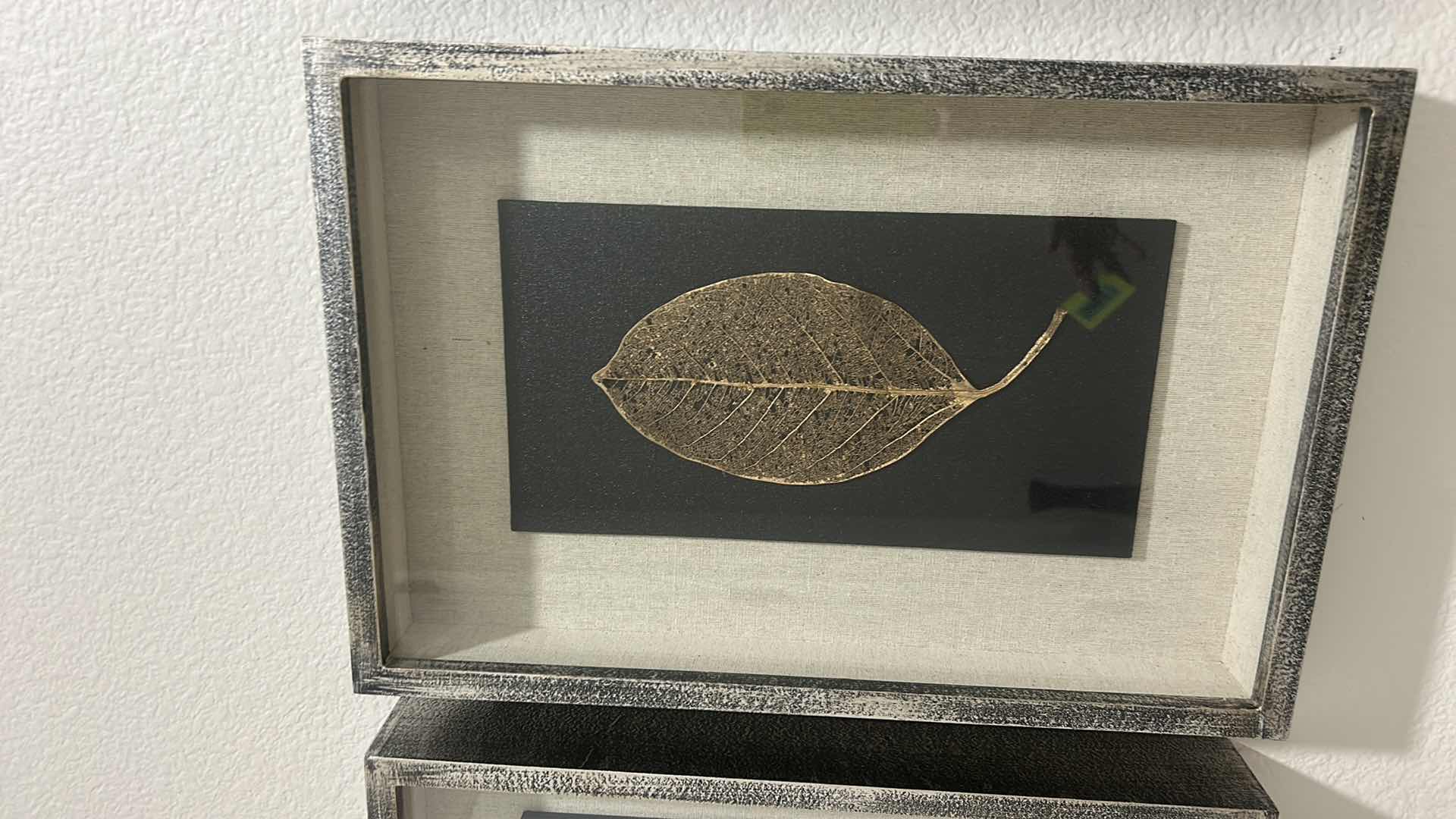 Photo 1 of GILDED LEAVES SHADOW BOXES SET OF 4 - PRESERVED LEAVES FINISHED IN ELEGANT GOLD AND SILVER LEAF, MOUNTED ON A BLACK LINEN BACKING, WITH AN OATMEAL LINEN INTERIOR LINER. SHADOW BOXES ARE FRAMED IN A HEAVILY BURNISHED SILVER LEAF.
DIMENSIONS: 12 W X 17 H X 