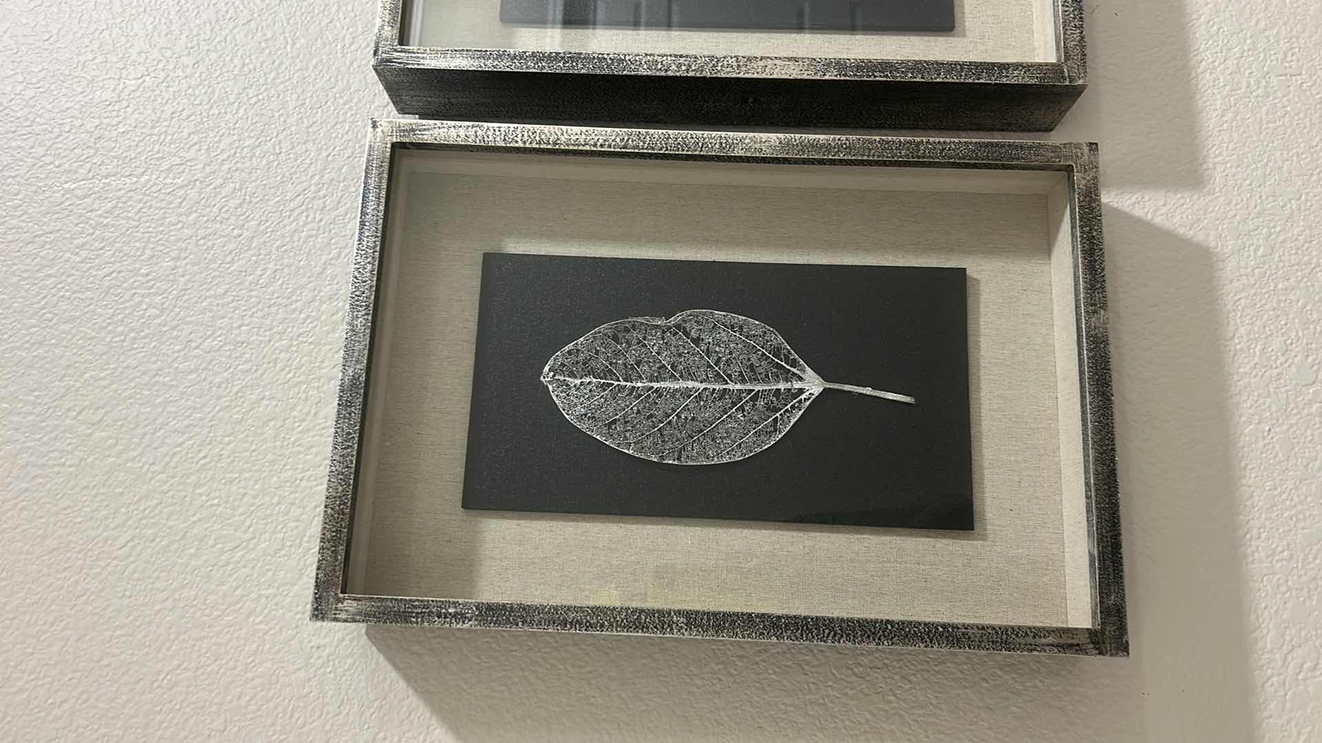 Photo 1 of GILDED LEAVES SHADOW BOXES SET OF 4 - PRESERVED LEAVES FINISHED IN ELEGANT GOLD AND SILVER LEAF, MOUNTED ON A BLACK LINEN BACKING, WITH AN OATMEAL LINEN INTERIOR LINER. SHADOW BOXES ARE FRAMED IN A HEAVILY BURNISHED SILVER LEAF.
DIMENSIONS: 12 W X 17 H X 
