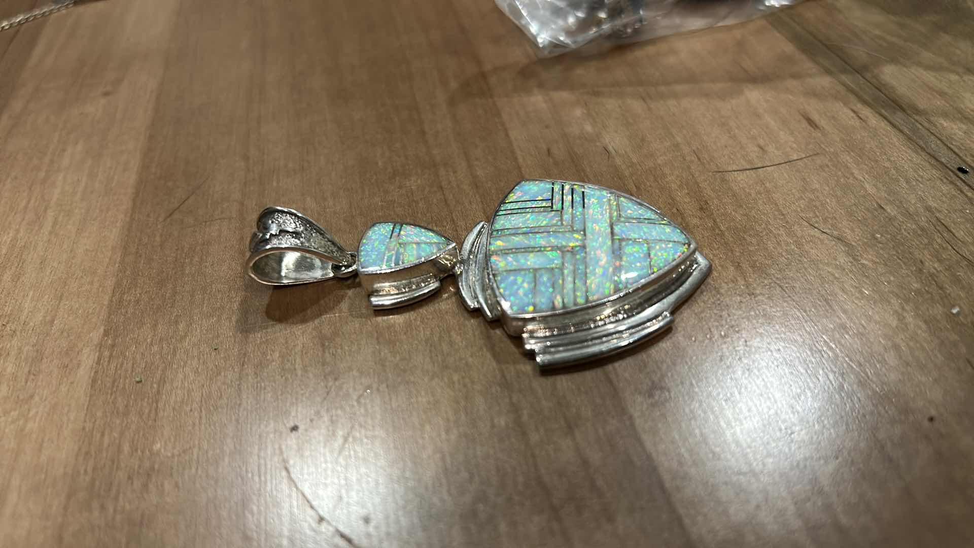 Photo 1 of HANDMADE “SUPER SMITHS” NATIVE AMERICAM STERLING SILVER OPAL INLAY SHIELD FORM PENDANT 3”

MARKED STERLING WITH BEAR PAW HALLMARK AND LETTER C