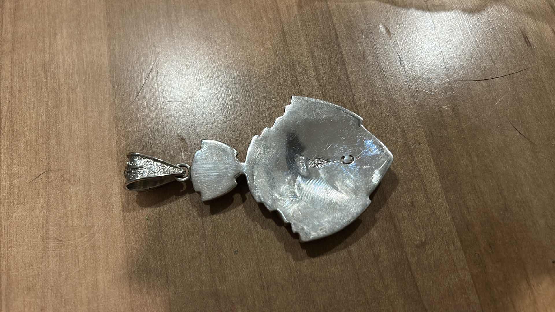 Photo 1 of HANDMADE “SUPER SMITHS” NATIVE AMERICAM STERLING SILVER OPAL INLAY SHIELD FORM PENDANT 3”

MARKED STERLING WITH BEAR PAW HALLMARK AND LETTER C