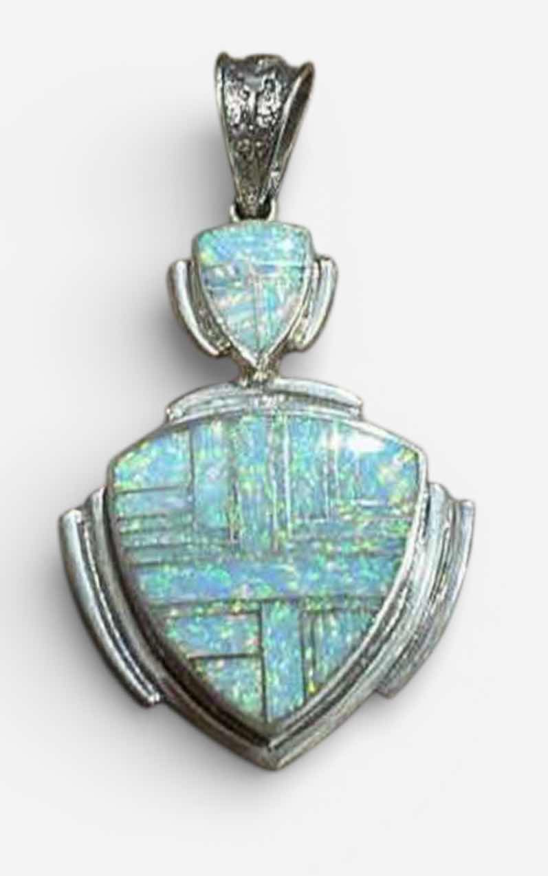 Photo 1 of HANDMADE “SUPER SMITHS” NATIVE AMERICAM STERLING SILVER OPAL INLAY SHIELD FORM PENDANT 3”

MARKED STERLING WITH BEAR PAW HALLMARK AND LETTER C