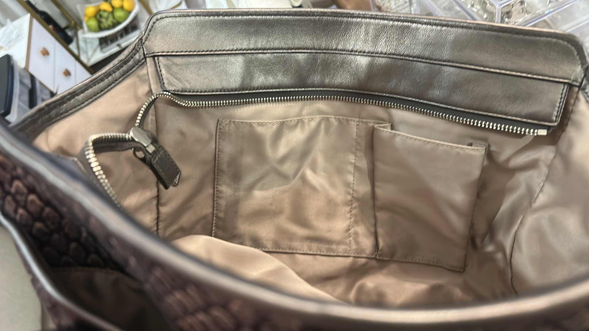 Photo 1 of COACH TAYLOR ALEXIS SNAKE PRINT CARRYALL SATCHEL HANDBAG (STYLE #F26034)

STATEMENT SATCHEL FEATURING A BOLD SNAKE PRINT FABRIC EXTERIOR WITH METALLIC LEATHER TRIM AND SILVER-TONE HARDWARE.