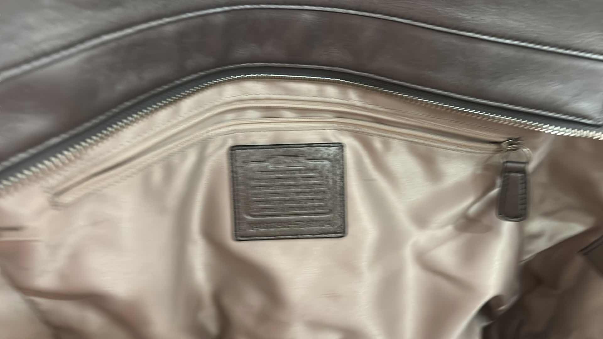 Photo 1 of COACH TAYLOR ALEXIS SNAKE PRINT CARRYALL SATCHEL HANDBAG (STYLE #F26034)

STATEMENT SATCHEL FEATURING A BOLD SNAKE PRINT FABRIC EXTERIOR WITH METALLIC LEATHER TRIM AND SILVER-TONE HARDWARE.