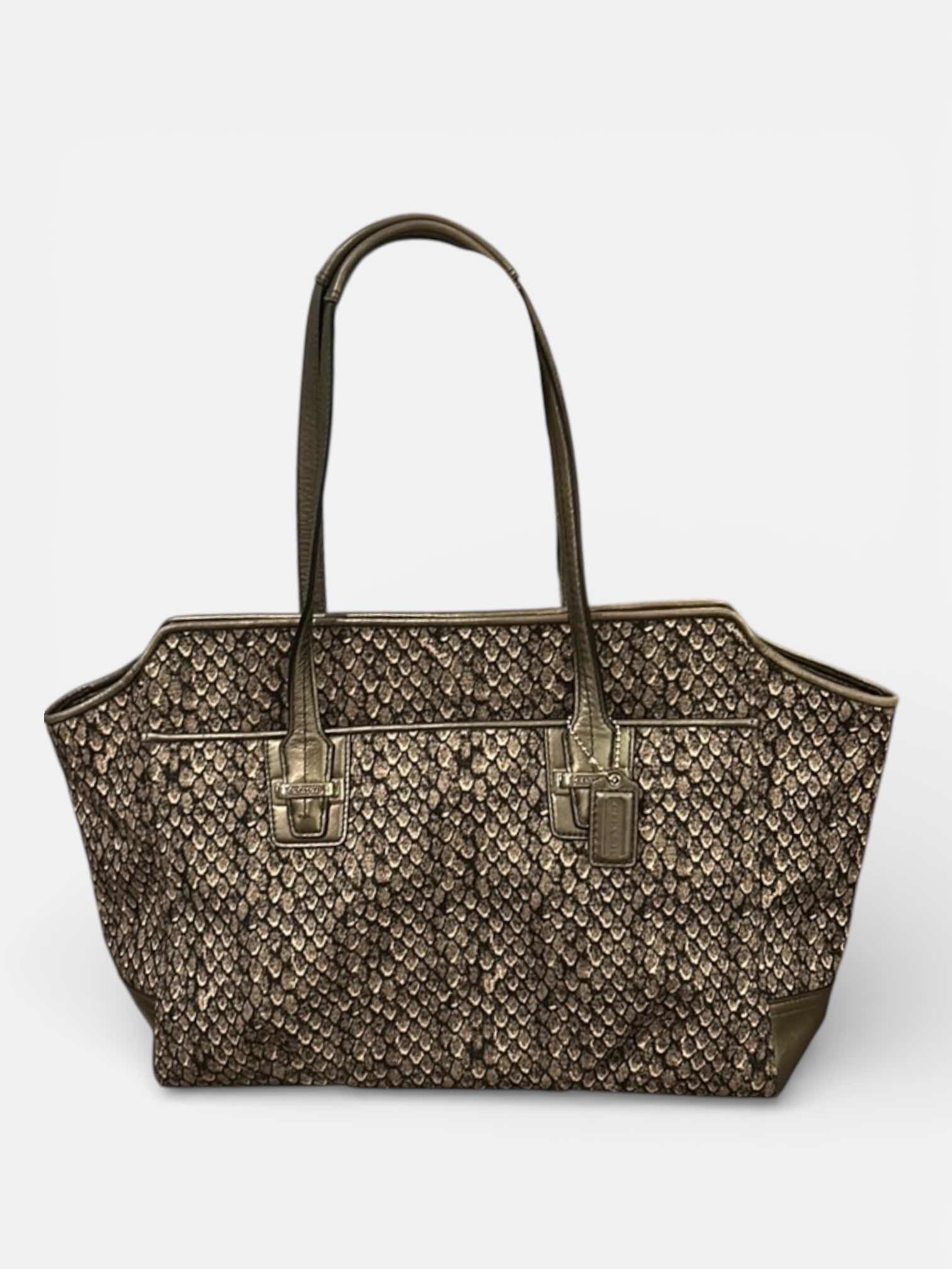 Photo 1 of COACH TAYLOR ALEXIS SNAKE PRINT CARRYALL SATCHEL HANDBAG (STYLE #F26034)

STATEMENT SATCHEL FEATURING A BOLD SNAKE PRINT FABRIC EXTERIOR WITH METALLIC LEATHER TRIM AND SILVER-TONE HARDWARE.