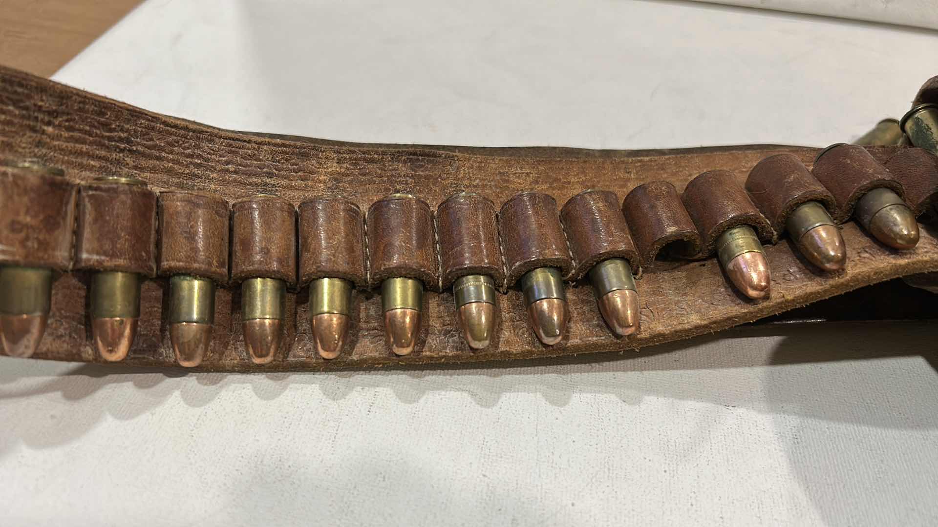 Photo 1 of ANTIQUE LEATHER BELT AND HOLSTER WITH FEDERAL 38 SPECIAL BULLETS