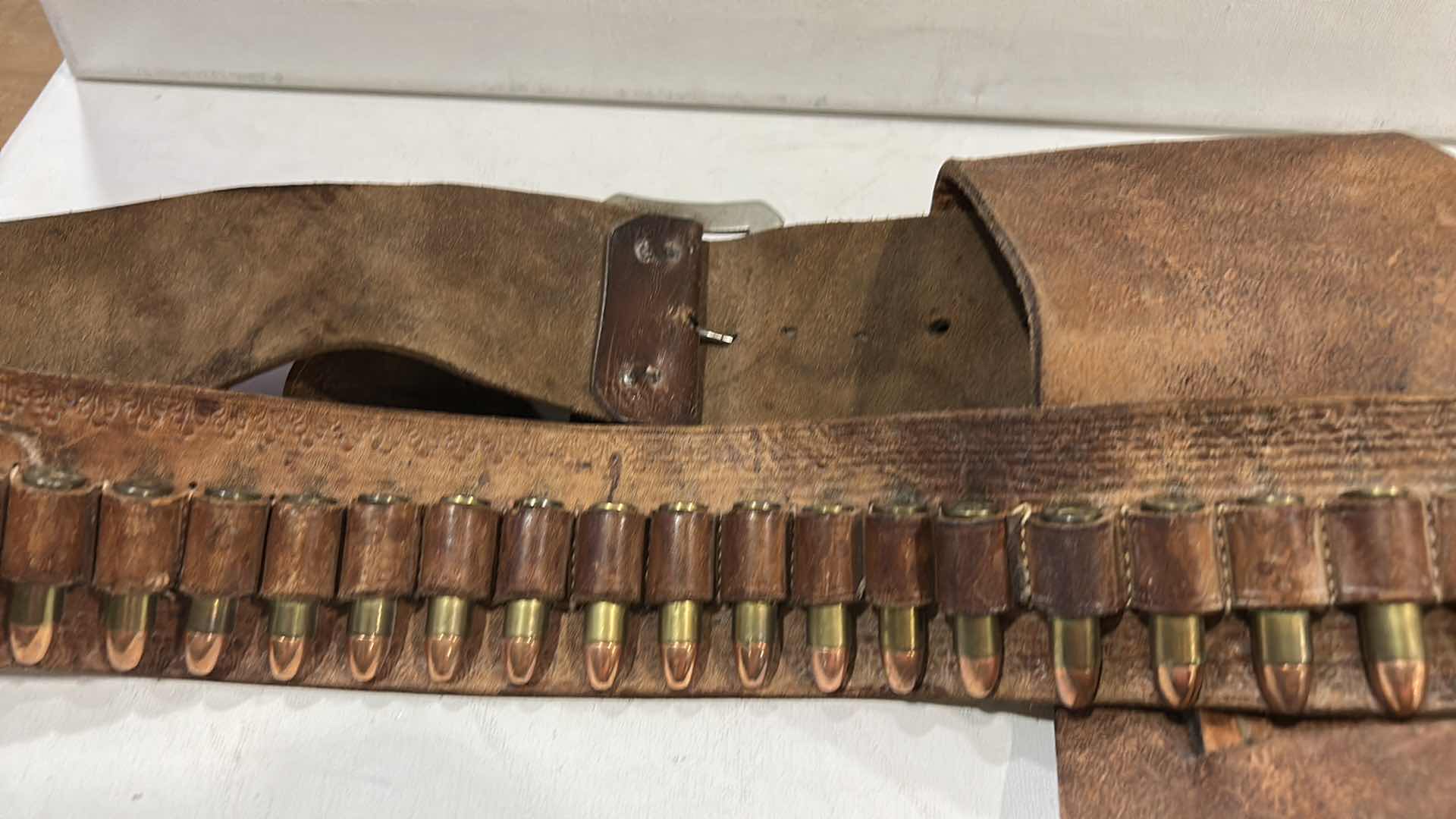 Photo 1 of ANTIQUE LEATHER BELT AND HOLSTER WITH FEDERAL 38 SPECIAL BULLETS