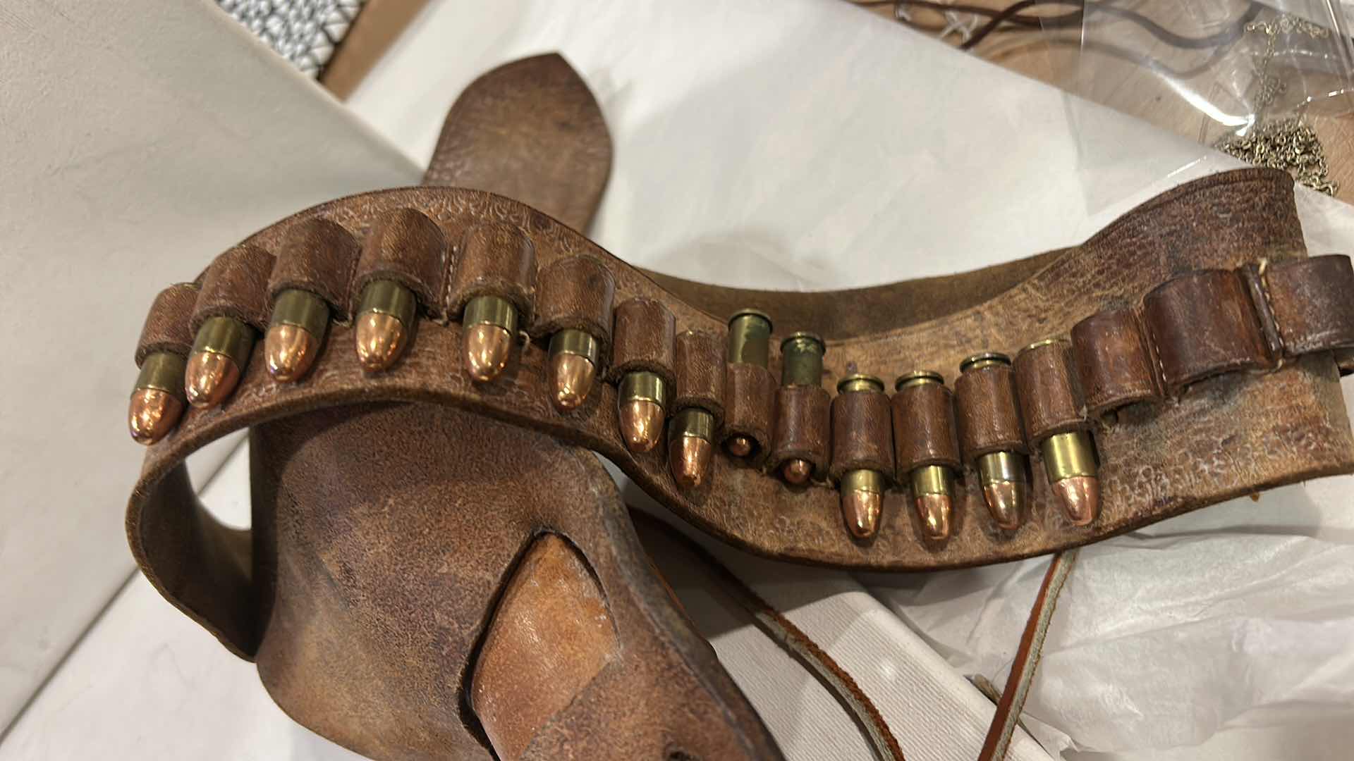 Photo 1 of ANTIQUE LEATHER BELT AND HOLSTER WITH FEDERAL 38 SPECIAL BULLETS