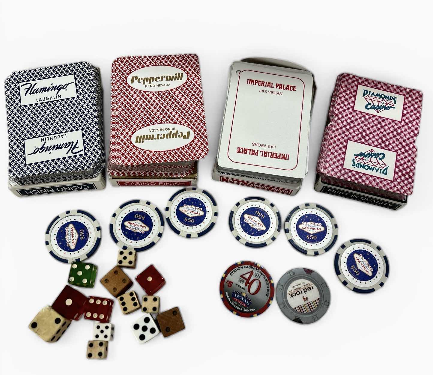 Photo 1 of LAS VEGAS CASINO PLAYING CARDS, DICE, 6 $50 REPLICA CHIPS AND 2 REAL CHIPS