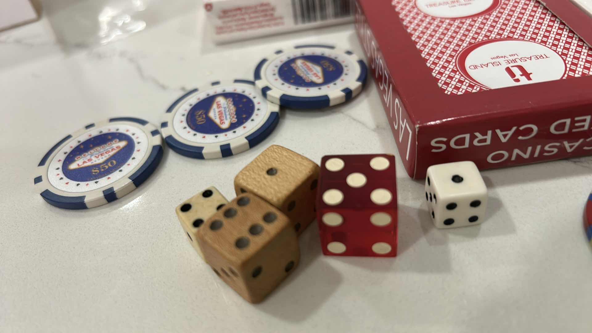 Photo 1 of LAS VEGAS CASINO PLAYING CARDS, DICE, 6 $50 REPLICA CHIPS AND 1 REAL CHIP, 1 COMMEMORATIVE TOKEN