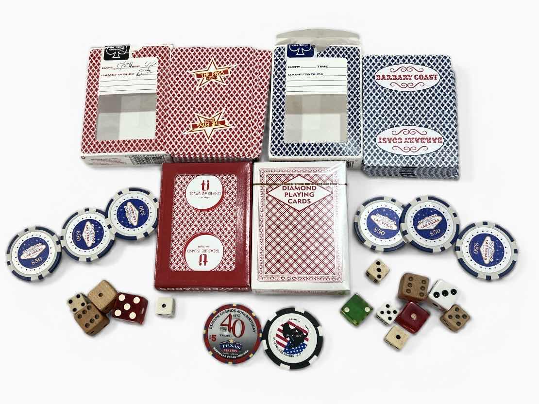 Photo 1 of LAS VEGAS CASINO PLAYING CARDS, DICE, 6 $50 REPLICA CHIPS AND 1 REAL CHIP, 1 COMMEMORATIVE TOKEN