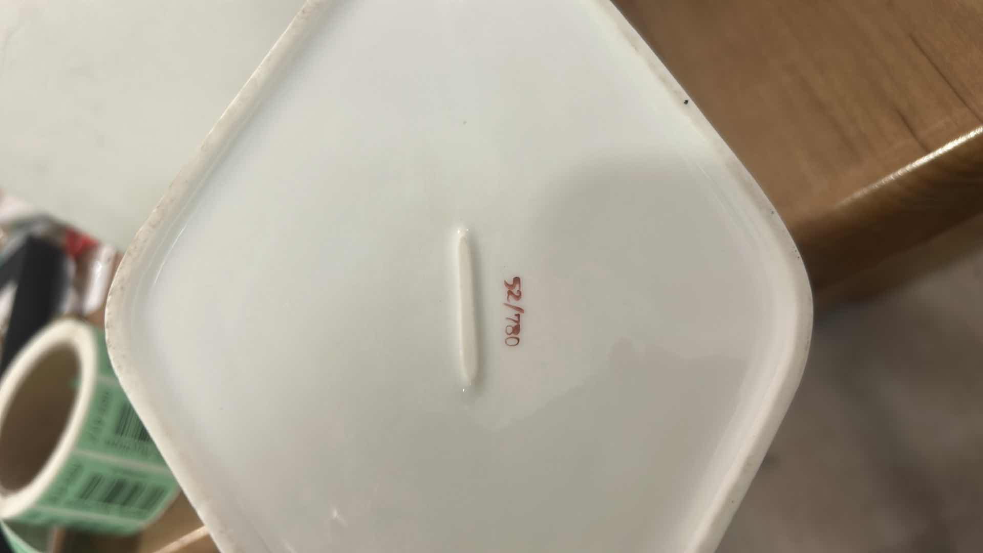 Photo 1 of VINTAGE DIAMOND-SHAPED PORCELAIN TRINKET BOX WITH FLORAL PATTERN ON LID.