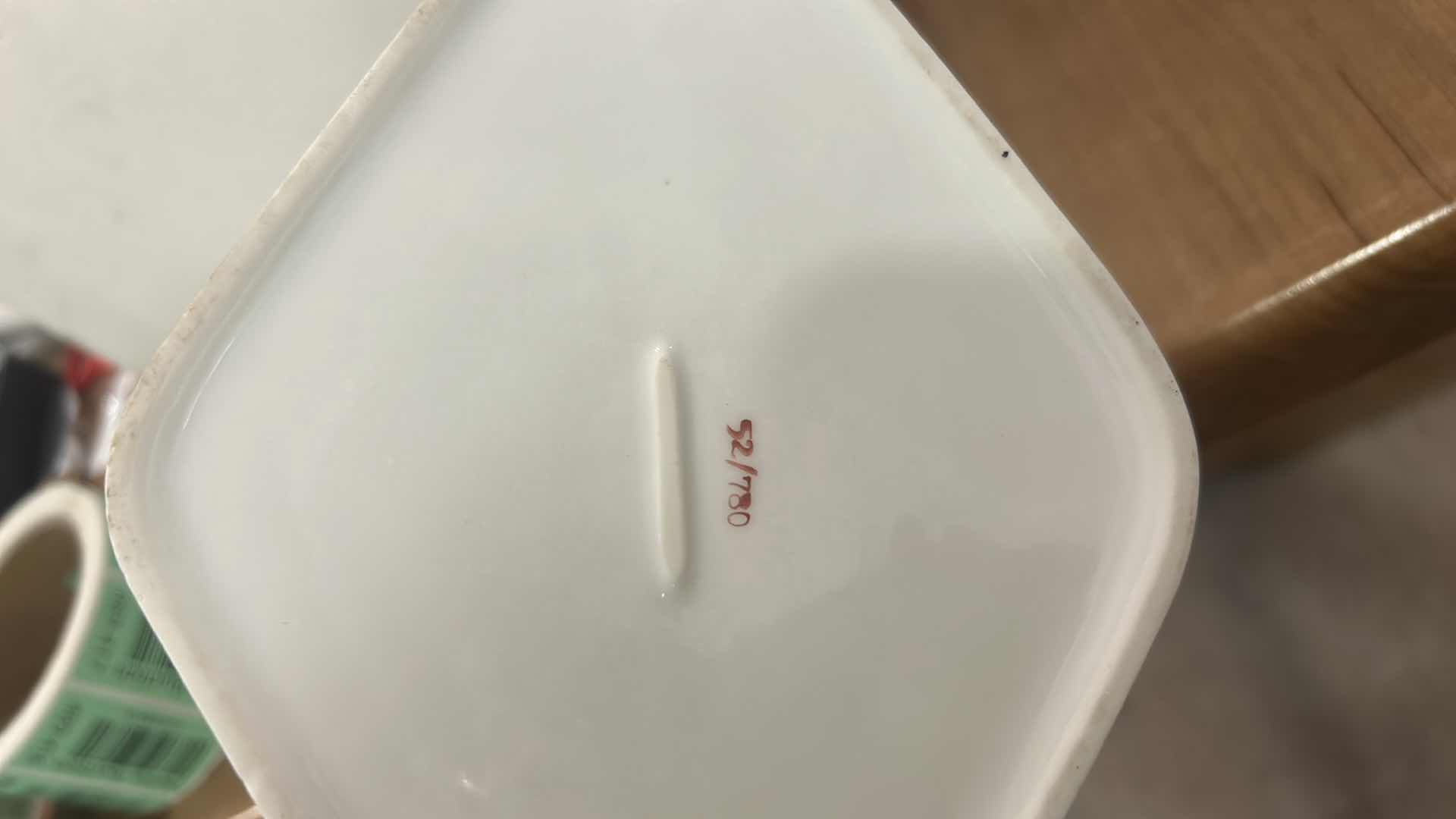 Photo 1 of VINTAGE DIAMOND-SHAPED PORCELAIN TRINKET BOX WITH FLORAL PATTERN ON LID.