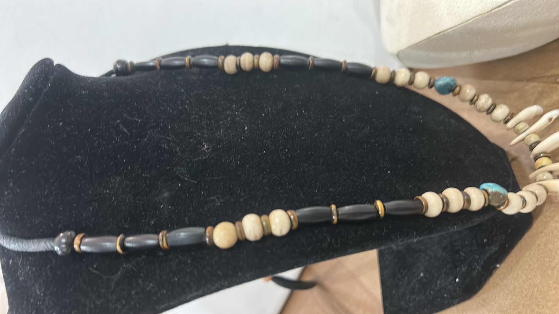 Photo 1 of SHAMAN STYLE NECKLACE FEATURING A COMBINATION OF NATURAL ELEMENTS, COMMONLY INCLUDING BUFFALO BONE BEADS, TURQUOISE STONES, AND EITHER ALLIGATOR OR BUFFALO TEETH. SUCH PIECES ARE OFTEN HANDCRAFTED AND MAY INCORPORATE MATERIALS LIKE SINEW AND WOOD ACCENTS.