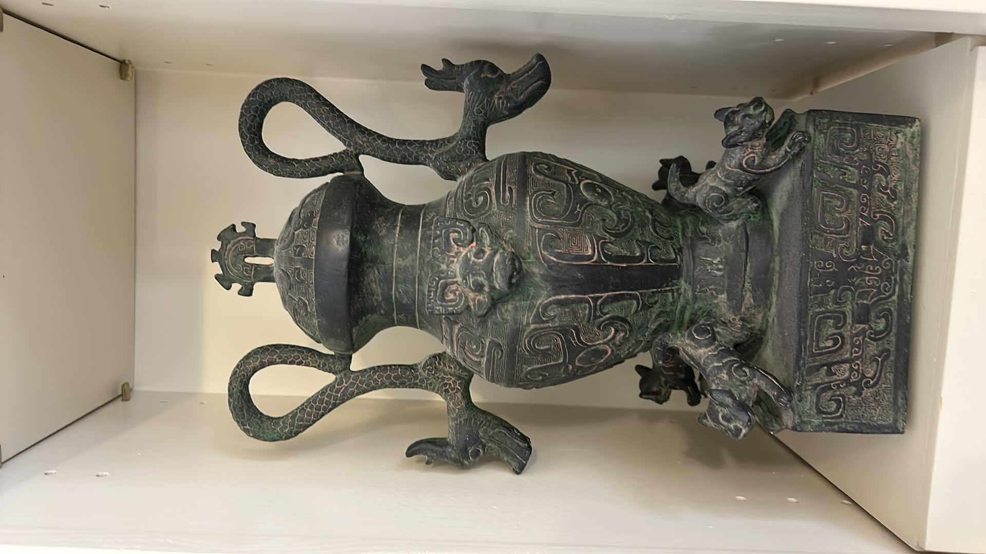 Photo 1 of CERAMIC ANTIQUE-STYLE CHINESE  VESSEL, SIMILAR IN DESIGN TO A LEI OR HU WINE CONTAINER. THESE VESSELS OFTEN FEATURE ZOOMORPHIC MASKS (TAOTIE), DRAGON-SHAPED HANDLES, AND A GREENISH PATINA. H12”