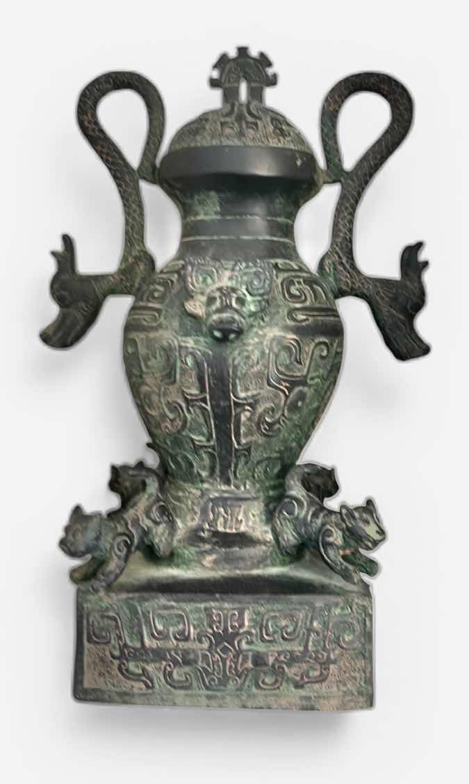 Photo 1 of CERAMIC ANTIQUE-STYLE CHINESE  VESSEL, SIMILAR IN DESIGN TO A LEI OR HU WINE CONTAINER. THESE VESSELS OFTEN FEATURE ZOOMORPHIC MASKS (TAOTIE), DRAGON-SHAPED HANDLES, AND A GREENISH PATINA. H12”