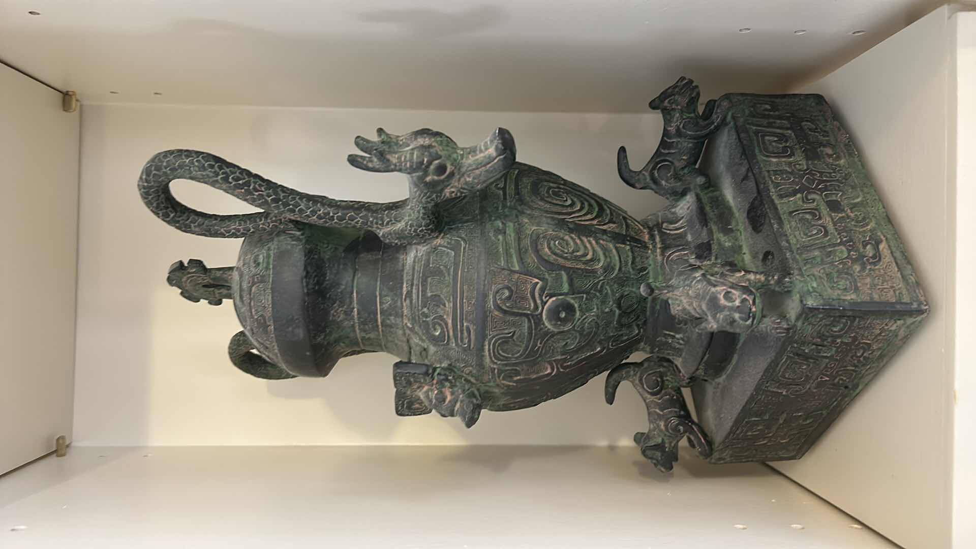 Photo 1 of CERAMIC ANTIQUE-STYLE CHINESE  VESSEL, SIMILAR IN DESIGN TO A LEI OR HU WINE CONTAINER. THESE VESSELS OFTEN FEATURE ZOOMORPHIC MASKS (TAOTIE), DRAGON-SHAPED HANDLES, AND A GREENISH PATINA. H12”