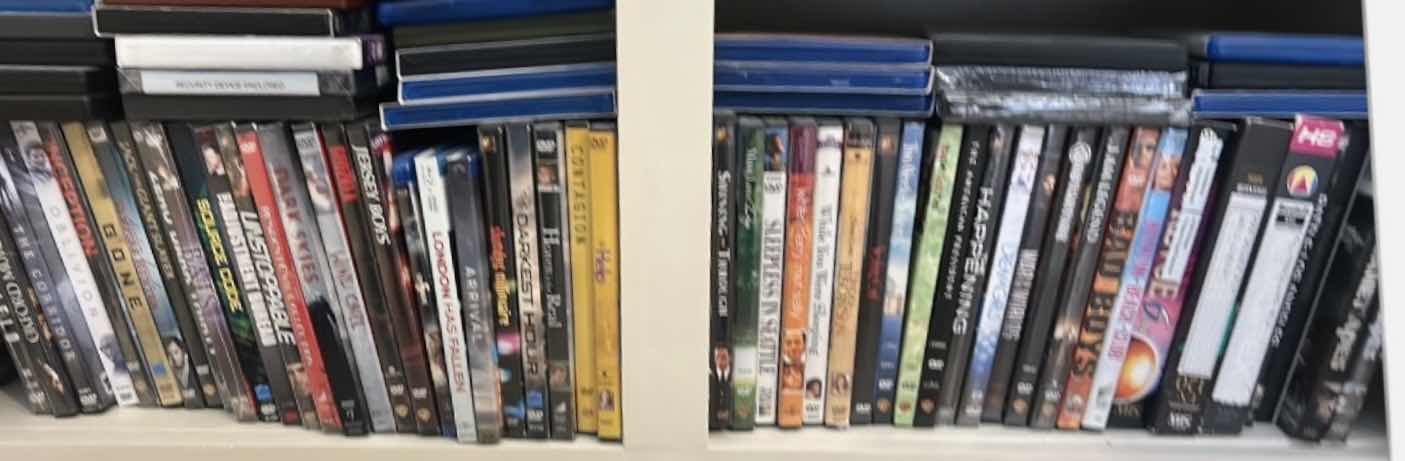 Photo 1 of 2 SHELVES OF DVD’S