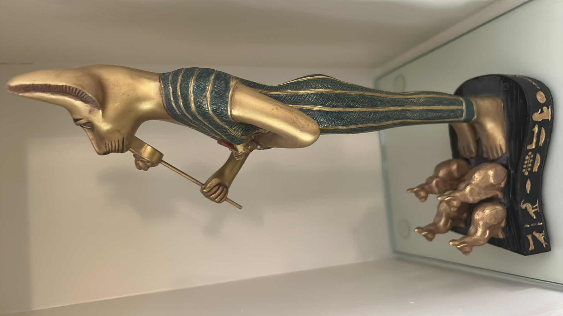 Photo 1 of CERAMIC DECORATIVE STATUE OF THE ANCIENT EGYPTIAN CAT GODDESS BASTET, OFTEN DEPICTED HOLDING A SISTRUM AND SURROUNDED BY SMALLER KITTENS. H13”