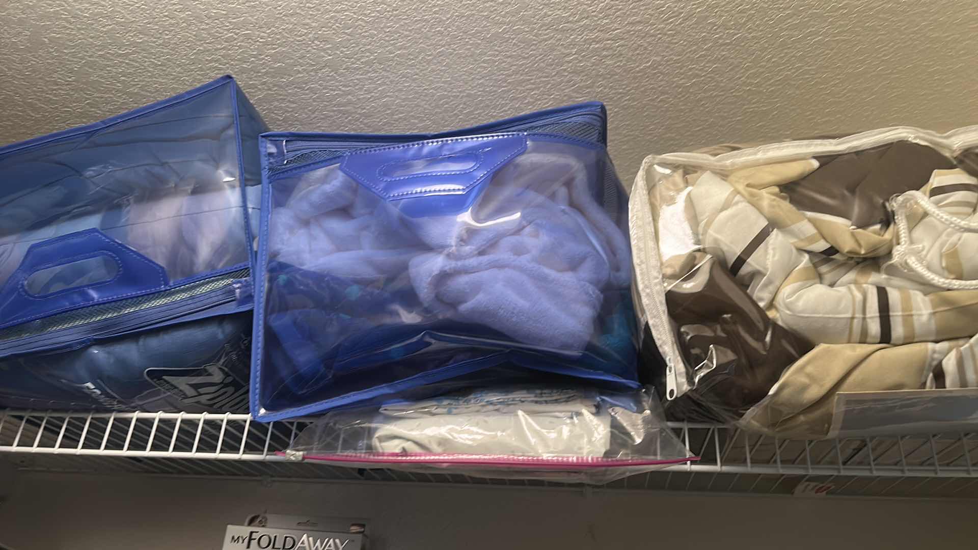 Photo 1 of BEDDING, CHAIR COVERS, RUGS AND MORE ON SHELVES IN CLOSET