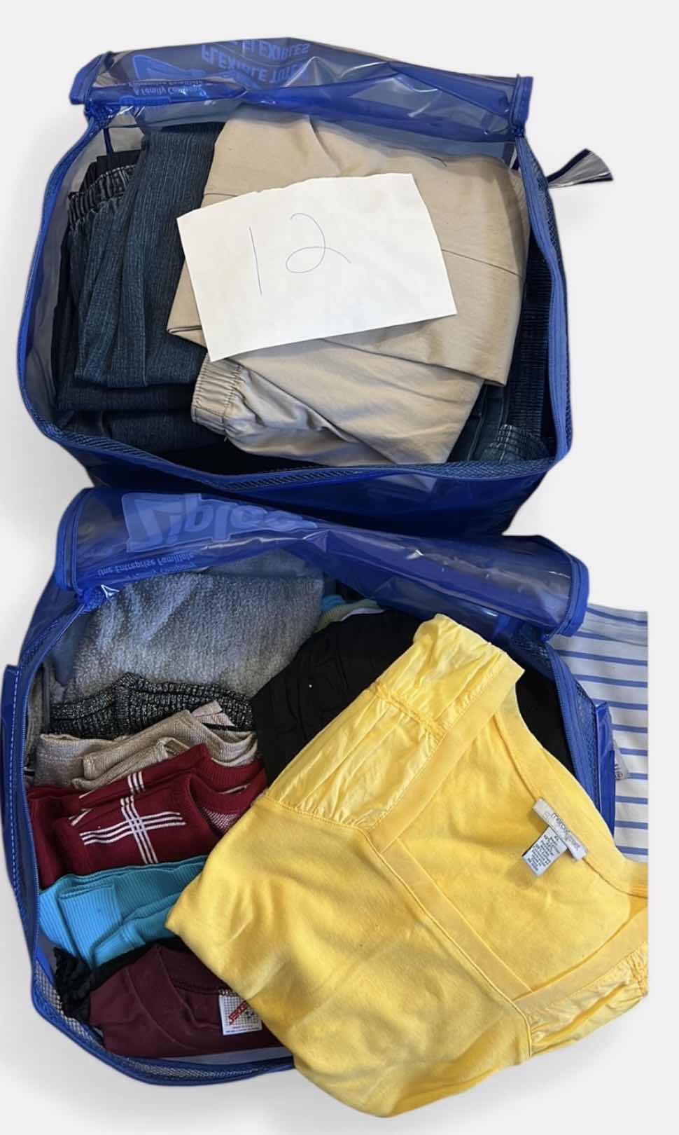 Photo 1 of 16 PAIRS WOMENS PANTS SIZE 12 AND BAG OF TOPS SIZE XL