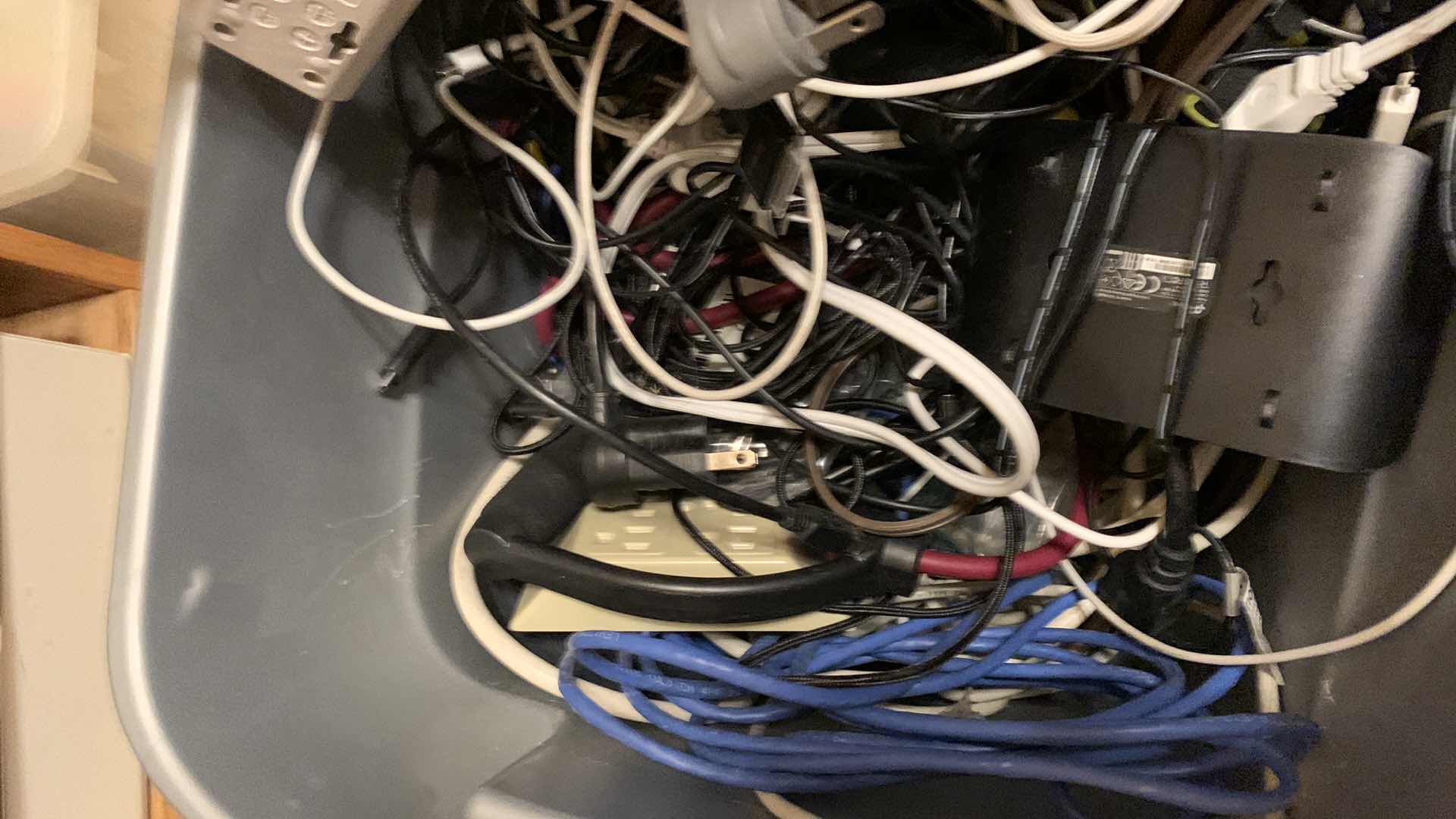 Photo 1 of BIN OF EXTENSION CORDS, SURGE PROTECTORS, AND NETWORK CABLES