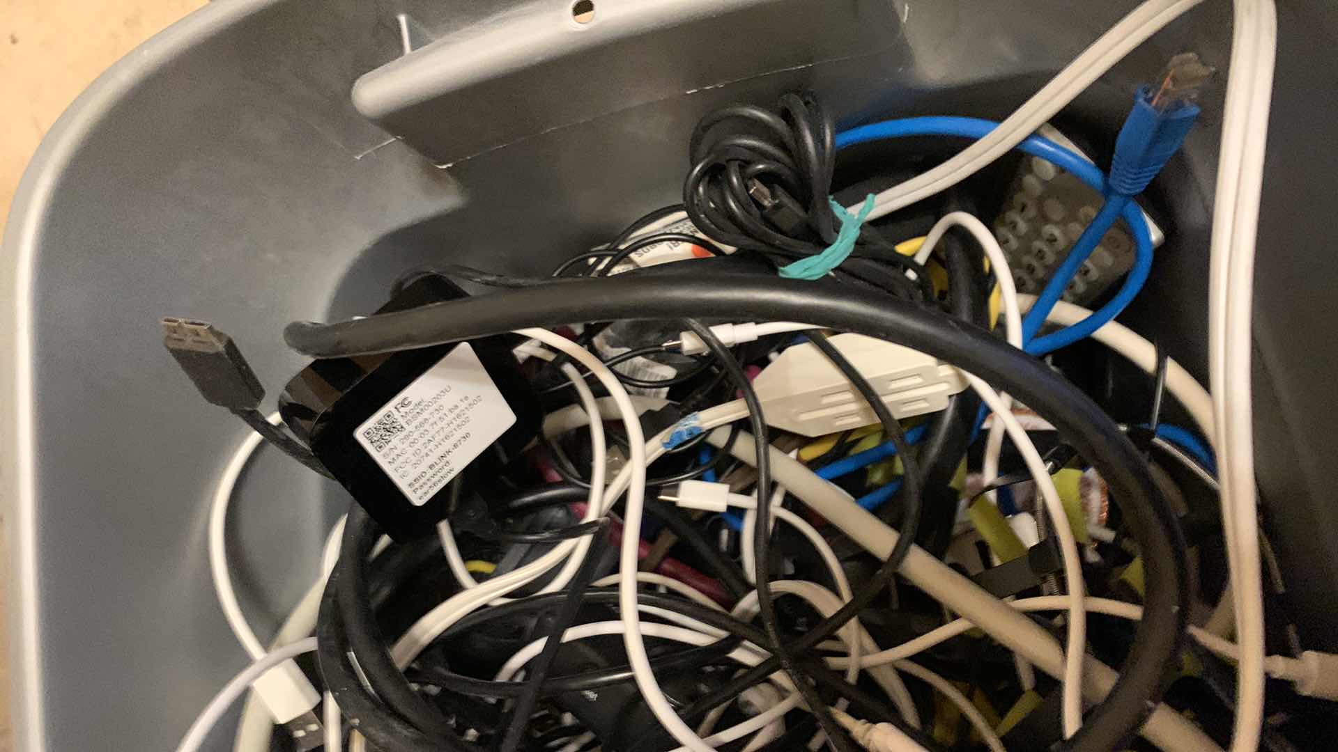Photo 1 of BIN OF EXTENSION CORDS, SURGE PROTECTORS, AND NETWORK CABLES