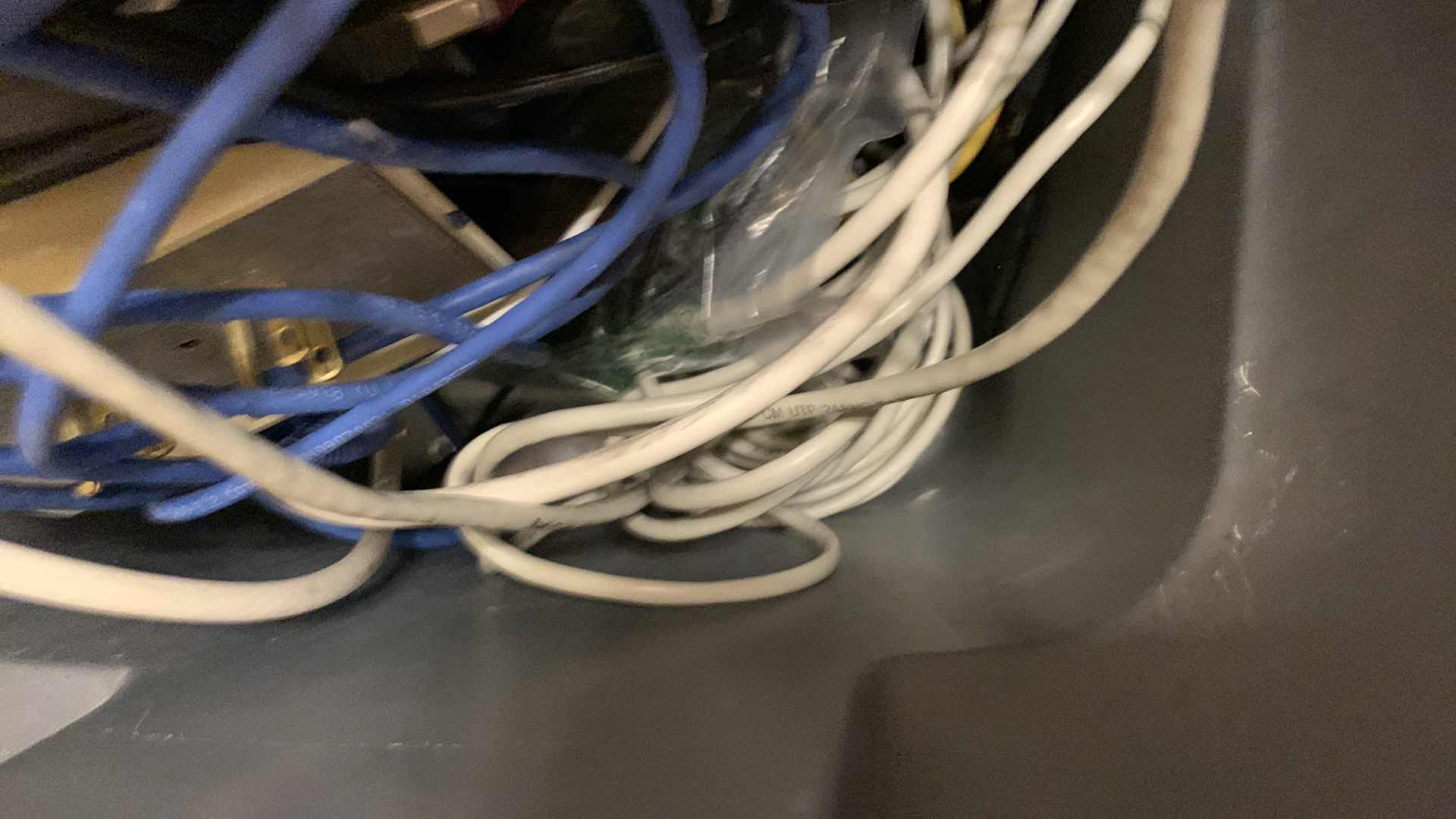 Photo 1 of BIN OF EXTENSION CORDS, SURGE PROTECTORS, AND NETWORK CABLES