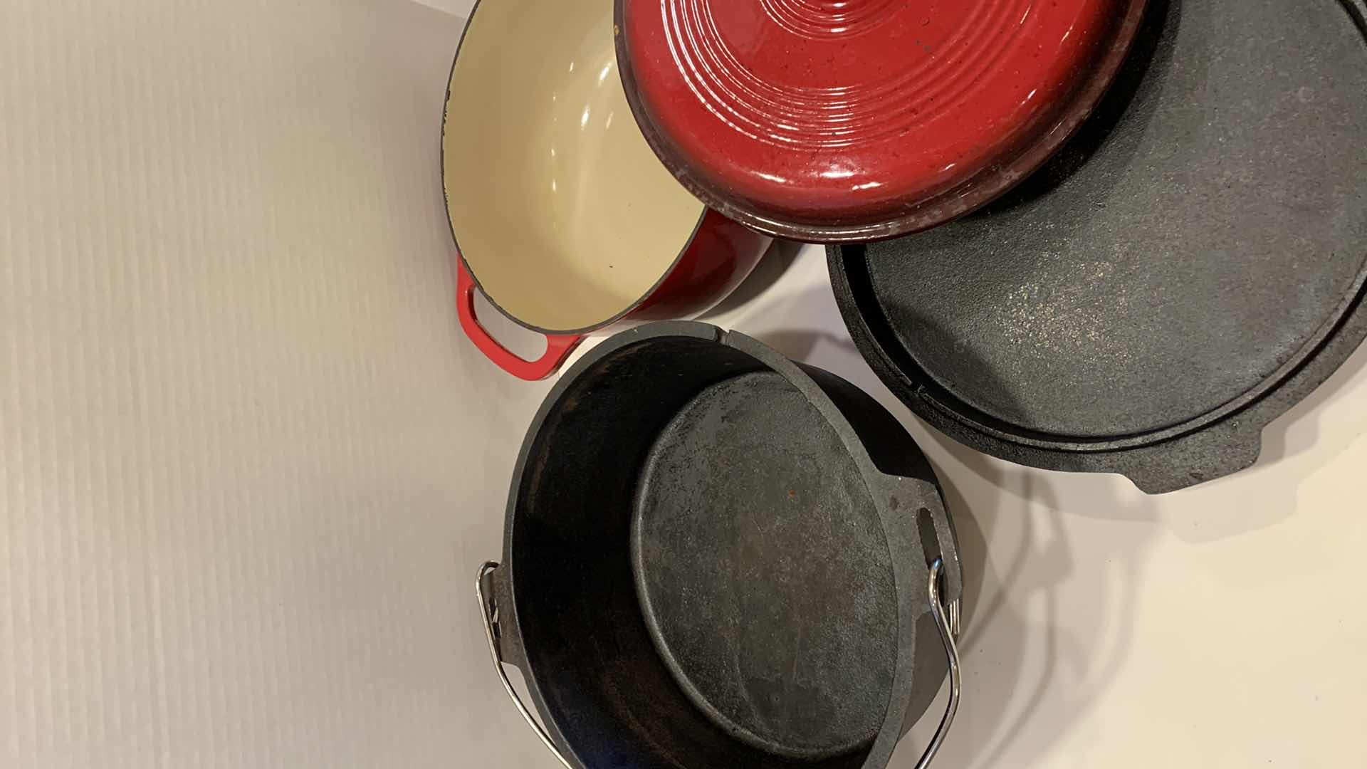 Photo 1 of 2-CAST IRON COOKWARE PIECES, LODGE AND LEWIS AND CLARK 6 QT