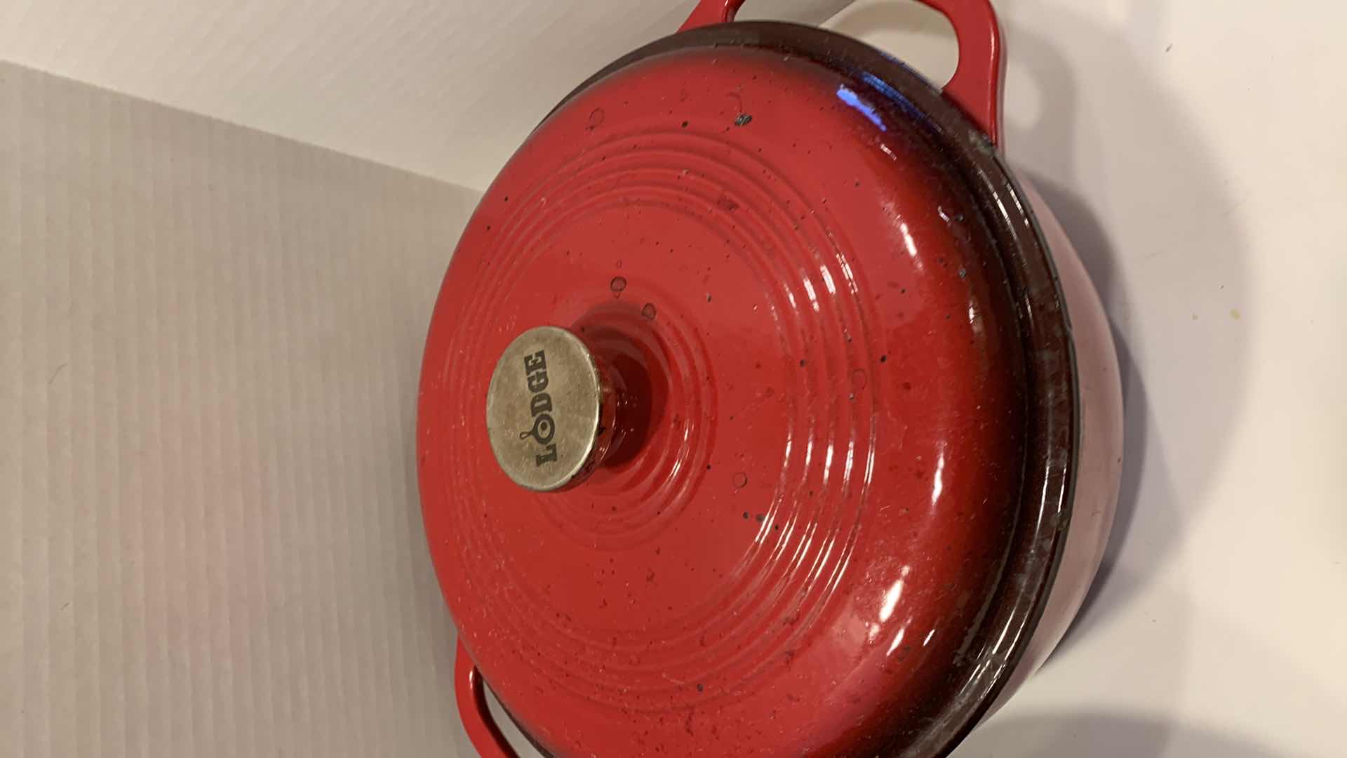 Photo 1 of 2-CAST IRON COOKWARE PIECES, LODGE AND LEWIS AND CLARK 6 QT