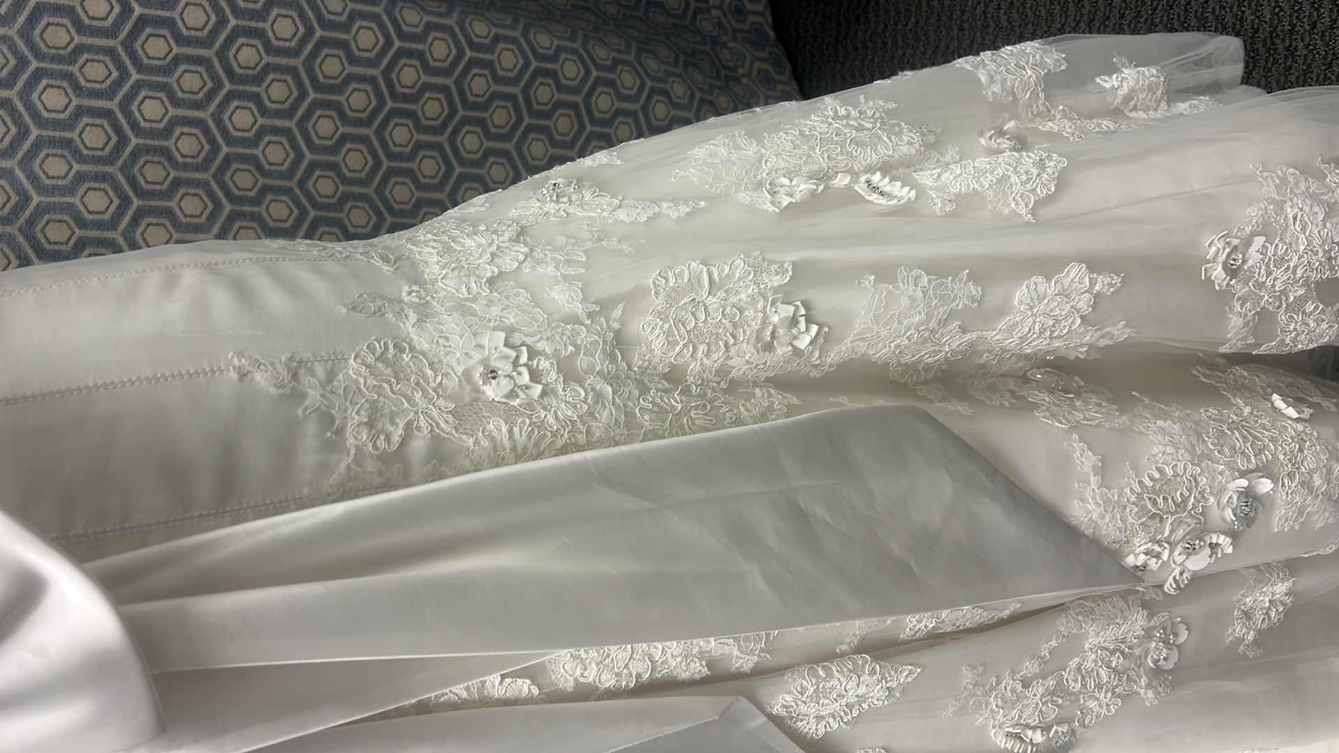 Photo 1 of BRIDAL GOWN “MAGGIE SOTTERO, IVORY ORGANZA AND TULLE WITH EMBELLISHED LACE, HANDMADE FLOWERS FEATURING LONG FULL TRAIN SIZE 8-10 