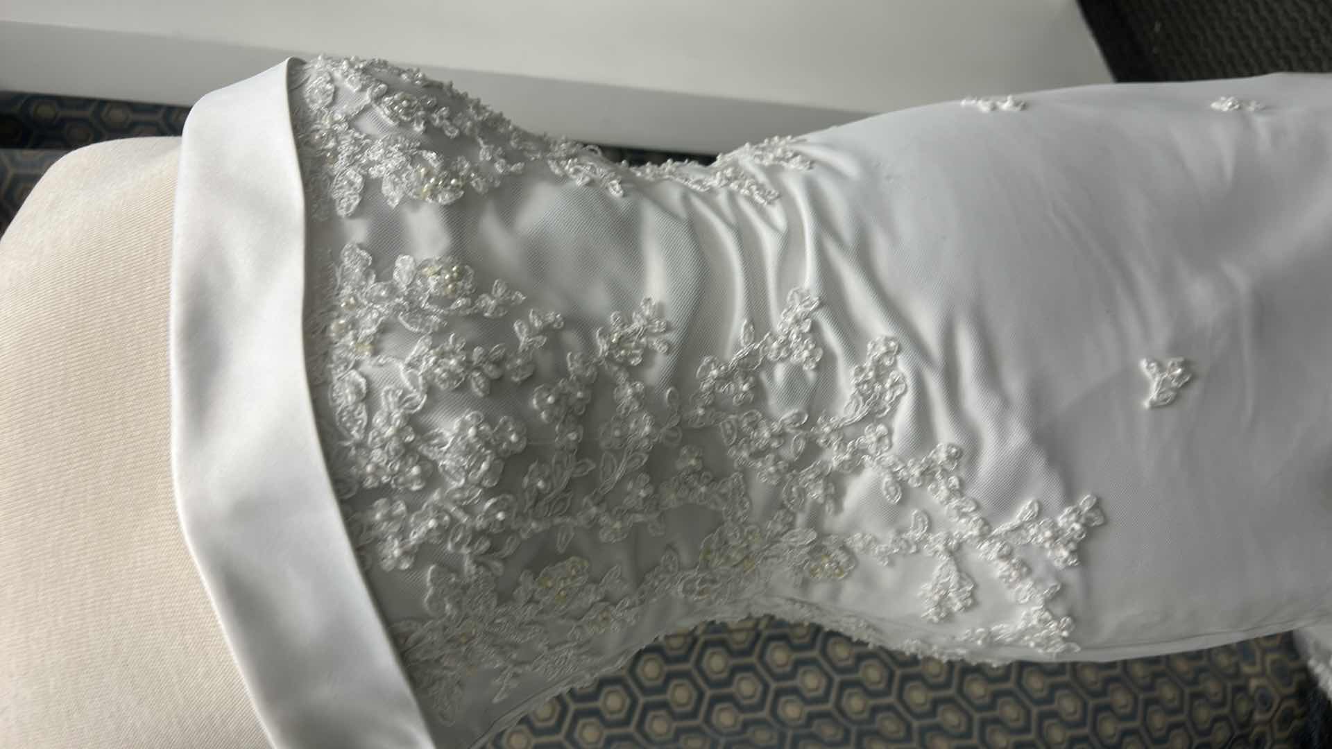 Photo 1 of BRIDAL GOWN, ONE-PIECE, SOFT ORGANZA OVER SATIN GOWN WITH FLOWER EMBELLISHMENTS AND A MEDIUM TRAIN SIZE 8,