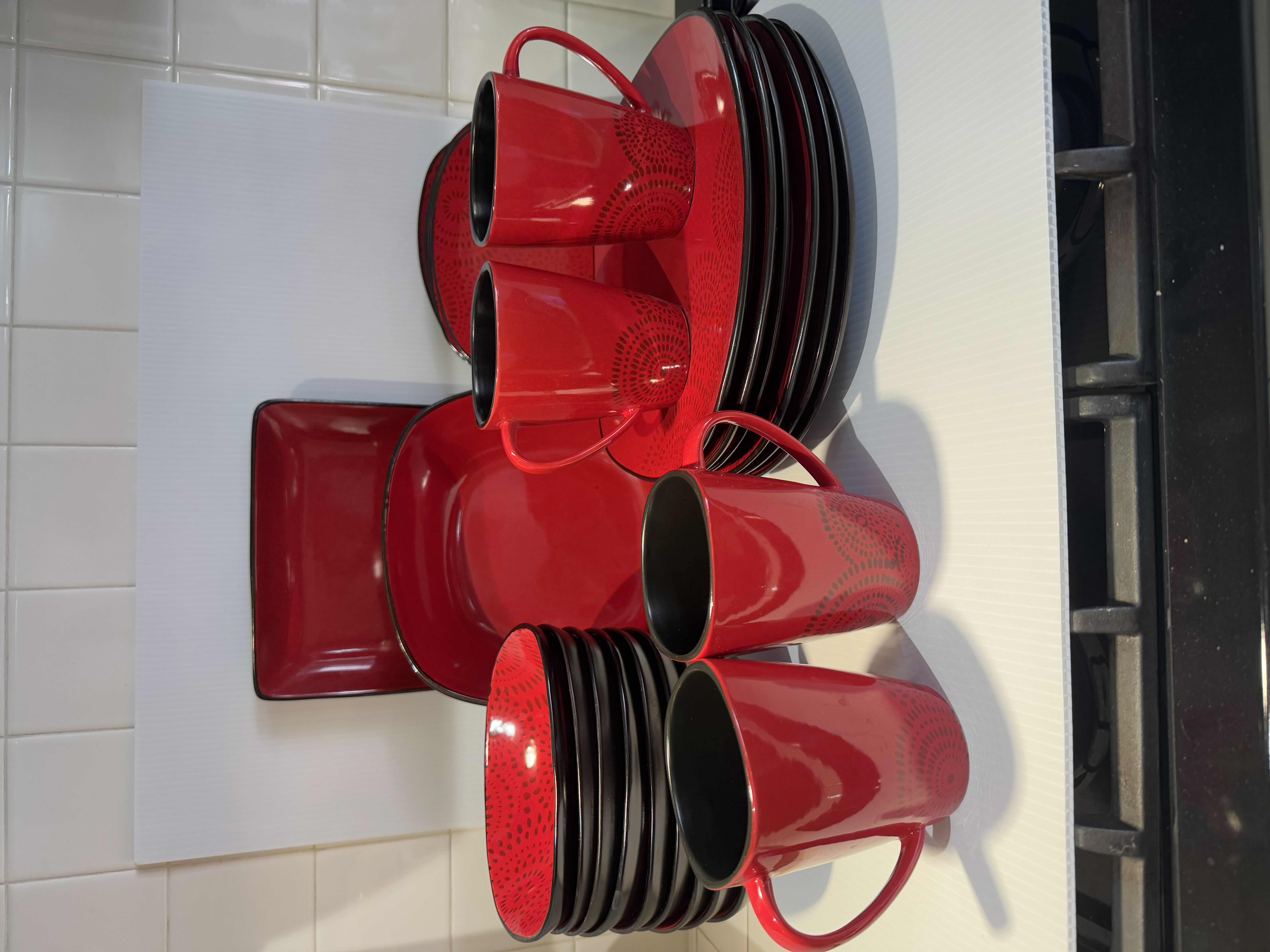 Photo 1 of 26 PIECE DINNER DISHES SET. RED AND BLACK DESIGNS. SOUP BOWLS, BREAD PLATES, COFFEE MUGS.